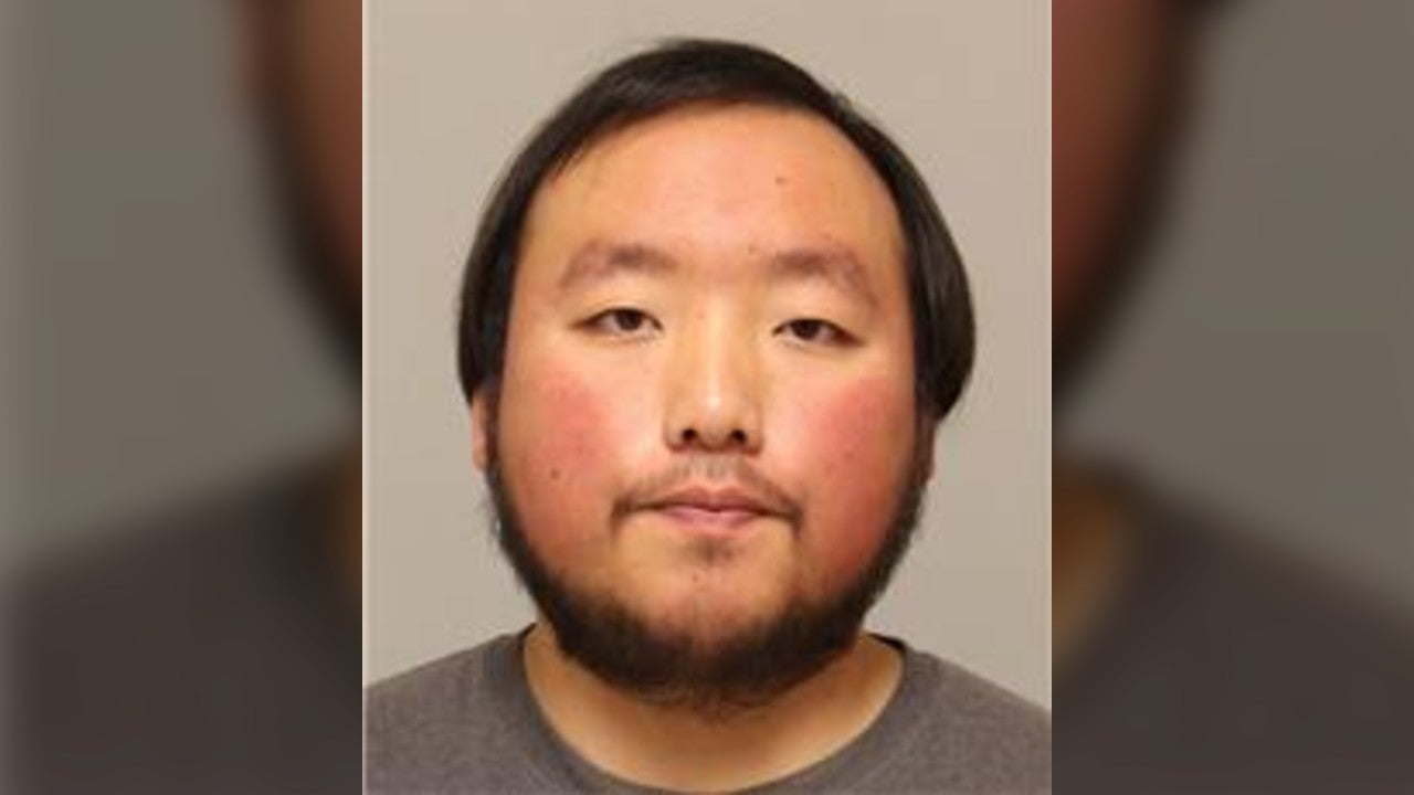 Correctional officer Minu Yang's booking photo after arrest for alleged drug smuggling at Lino Lakes facility.